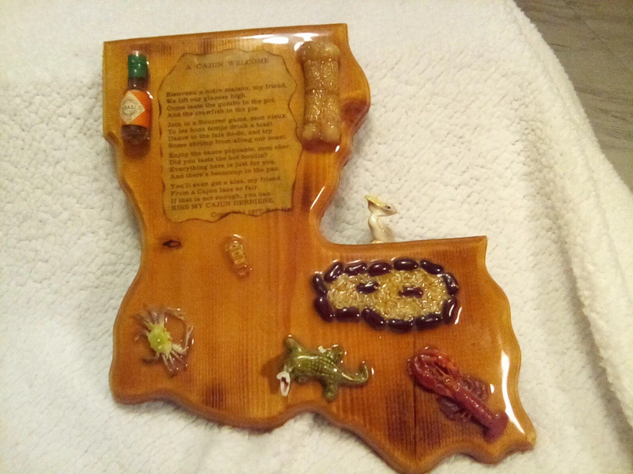 Louisiana-shaped decoupage plaque with A Cajun Welcome toast by Bob Hamm